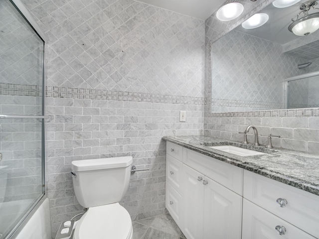 250 Gorge Rd Unit 16D, Cliffside Park, NJ 07010 - bathroom with tile walls, vanity, and bath / shower combo with glass door