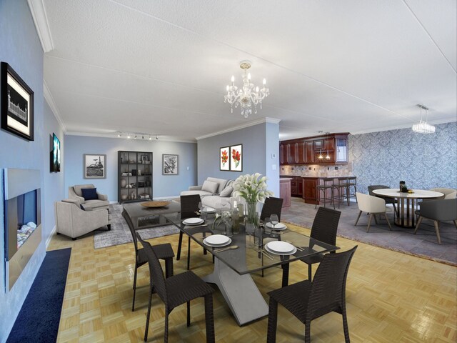 250 Gorge Rd Unit 16D, Cliffside Park, NJ 07010 - dining area with crown molding, a chandelier, wallpapered walls, and a fireplace