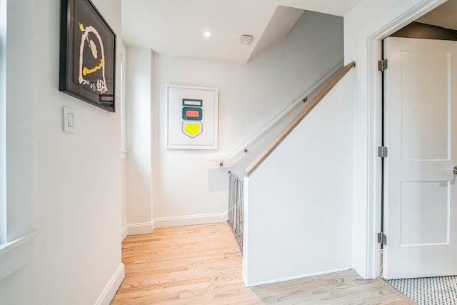 stairs featuring baseboards and wood finished floors