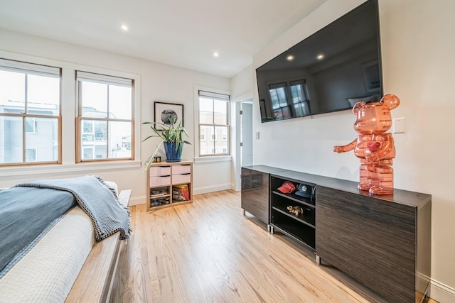 bedroom featuring recessed lighting, baseboards, and light wood-type flooring