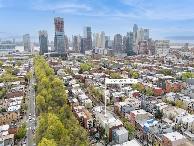 birds eye view of property with a view of city