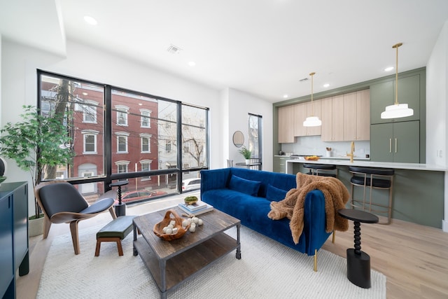 100 Webster Ave Unit 2, Jersey City, NJ 07307 - living area with recessed lighting and light wood-style floors