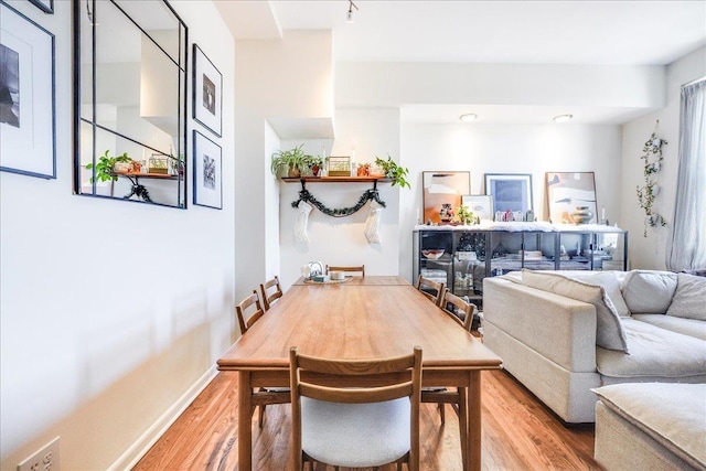 dining area with hardwood / wood-style floors