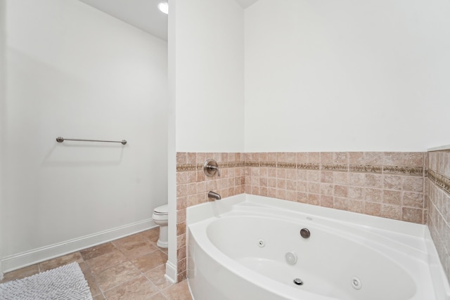 20 Avenue At Port Imperial Unit 113, West New York, NJ 07093 - full bath with a whirlpool tub, toilet, and baseboards