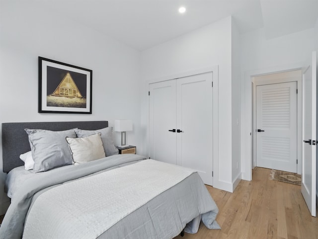 63 Jefferson Ave Unit 1, Jersey City, NJ 07307 - bedroom featuring light wood-style flooring, a closet, and recessed lighting