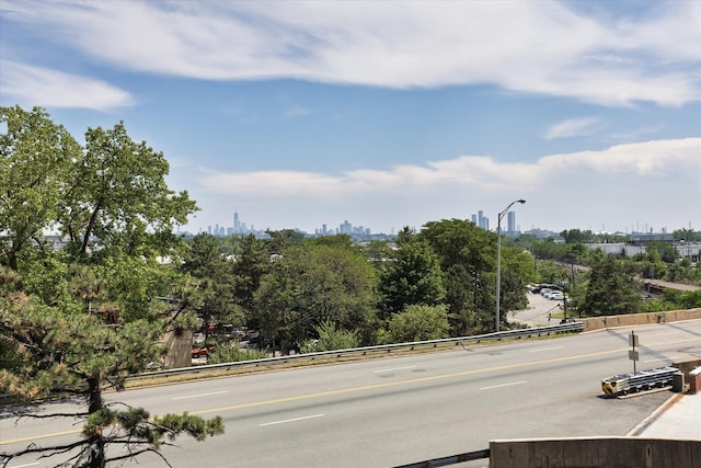 401 Harmon Cv, Secaucus, NJ 07094 - view of asphalt street with street lights, curbs, and a view of skyline
