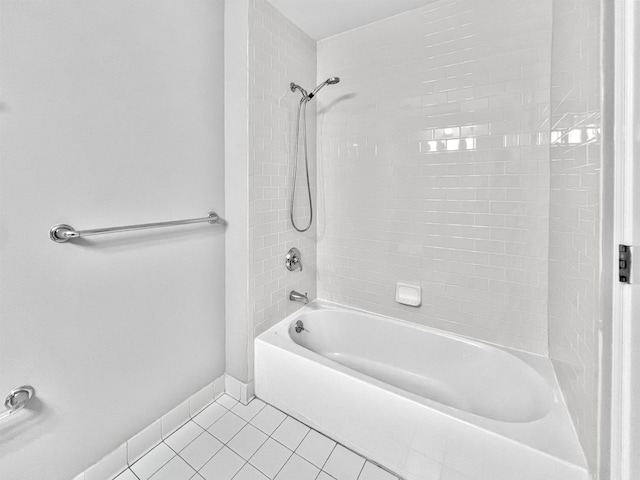 bathroom with tile patterned flooring and tiled shower / bath combo