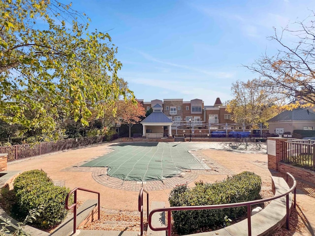 view of swimming pool with a patio