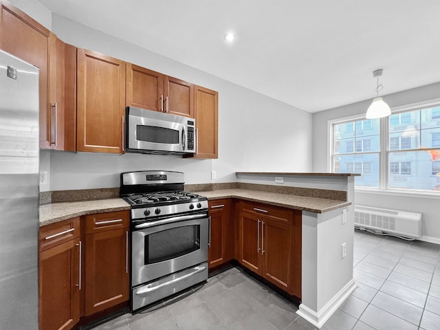 kitchen with stainless steel appliances, light tile patterned flooring, light stone counters, kitchen peninsula, and decorative light fixtures