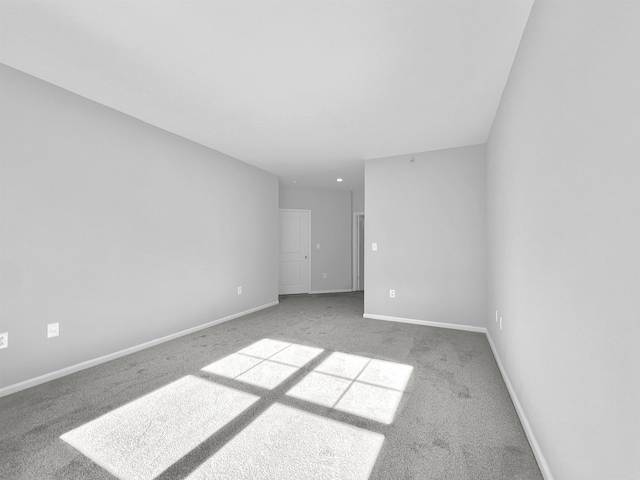 empty room with light colored carpet