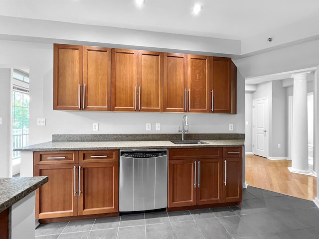 kitchen with dark hardwood / wood-style floors, sink, ornate columns, and dishwasher