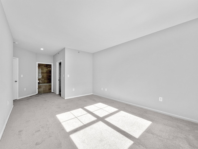 empty room featuring light colored carpet