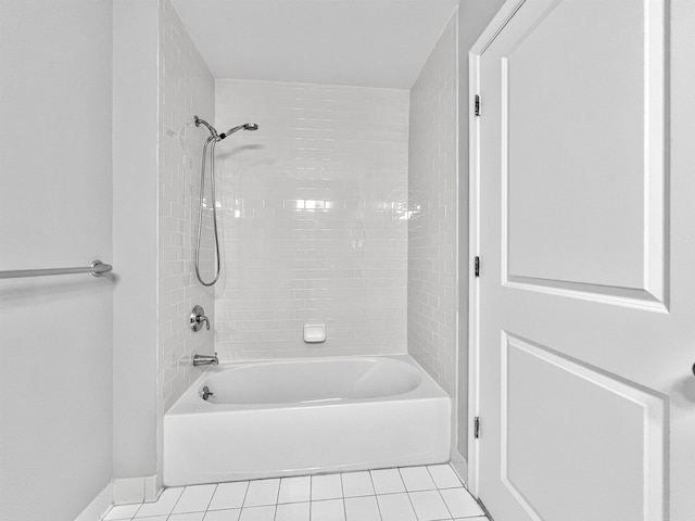 bathroom featuring tile patterned flooring and tiled shower / bath combo