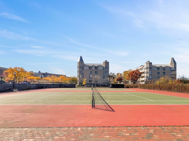 view of tennis court featuring basketball court