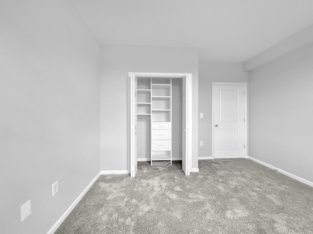 unfurnished bedroom featuring a closet and carpet