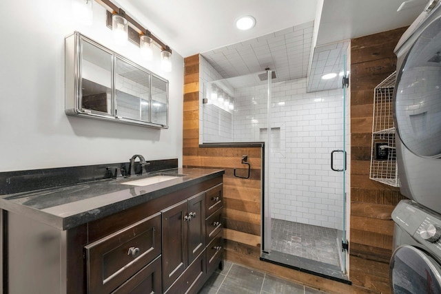 1228 Park Ave Unit B, Hoboken, NJ 07030 - full bathroom featuring stacked washer / drying machine, vanity, a shower stall, recessed lighting, and tile patterned floors