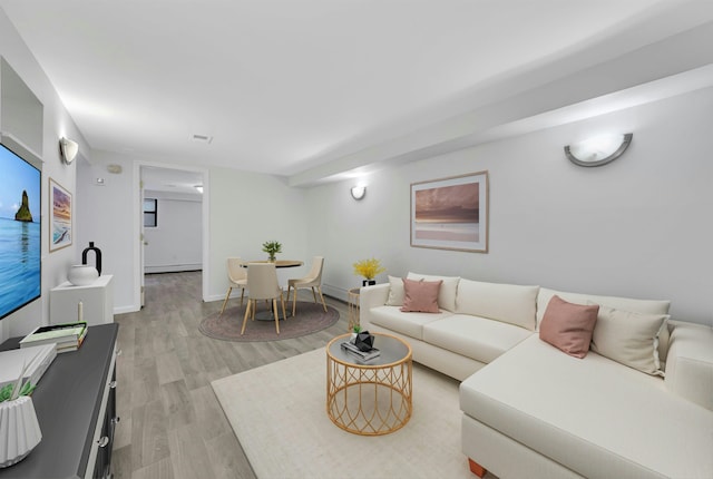 1228 Park Ave Unit B, Hoboken, NJ 07030 - living area featuring light wood-style flooring, a baseboard radiator, and baseboards