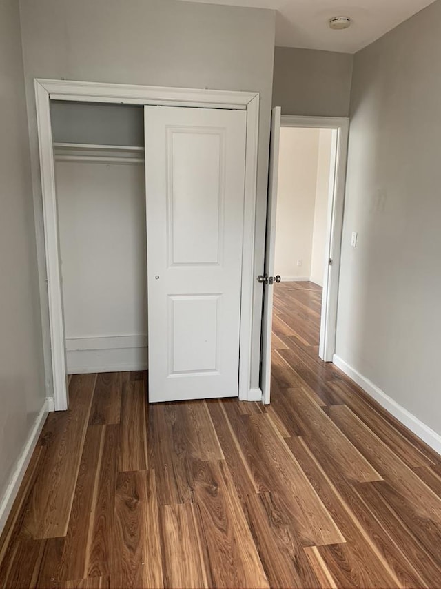 5843 Kennedy Blvd, North Bergen, NJ 07047 - unfurnished bedroom with wood finished floors, baseboards, and a closet