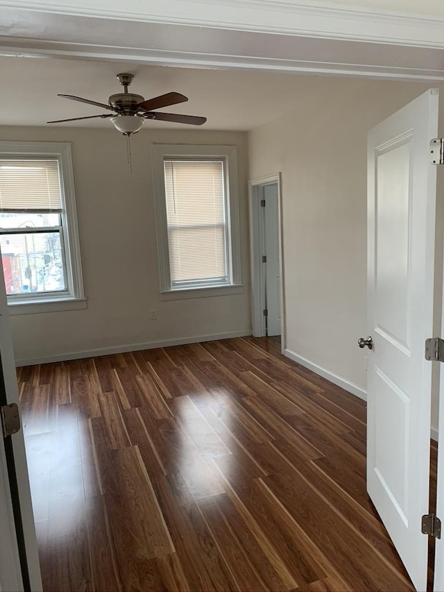 5843 Kennedy Blvd, North Bergen, NJ 07047 - empty room featuring dark wood-style flooring, ceiling fan, and baseboards