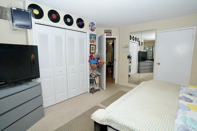 carpeted bedroom with a closet