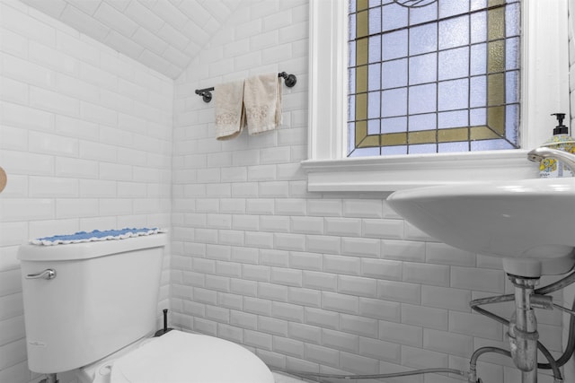 2746 John F Kennedy Blvd, Jersey City, NJ 07306 - half bathroom with toilet, lofted ceiling, and tile walls