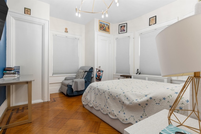 2746 John F Kennedy Blvd, Jersey City, NJ 07306 - bedroom featuring radiator and a notable chandelier