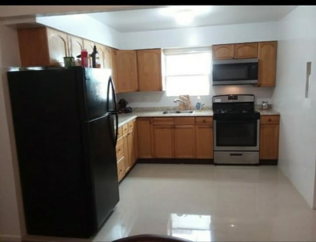 1215 Bergenline Ave, Union City, NJ 07087 - kitchen featuring stainless steel appliances, a sink, and light countertops