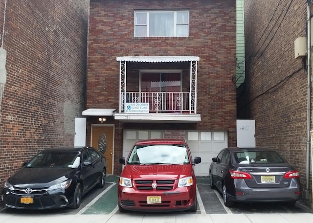 1215 Bergenline Ave, Union City, NJ 07087 - townhome / multi-family property featuring a garage, brick siding, and a balcony