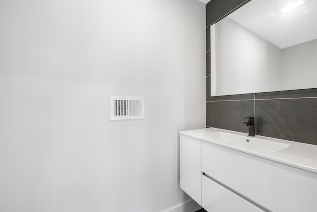 bathroom with visible vents and vanity