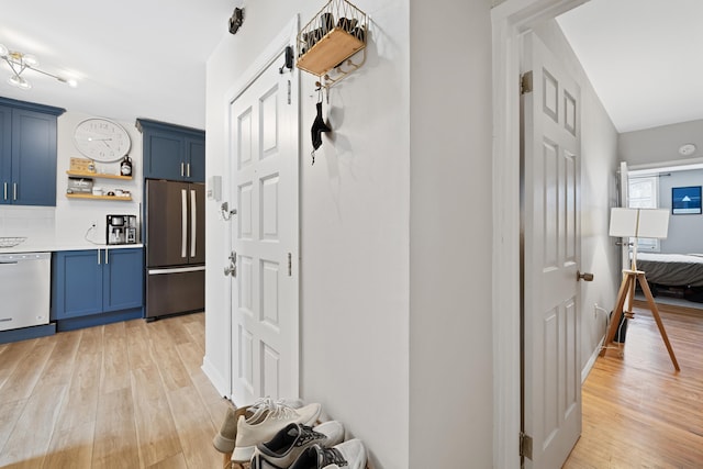 hall with light hardwood / wood-style floors