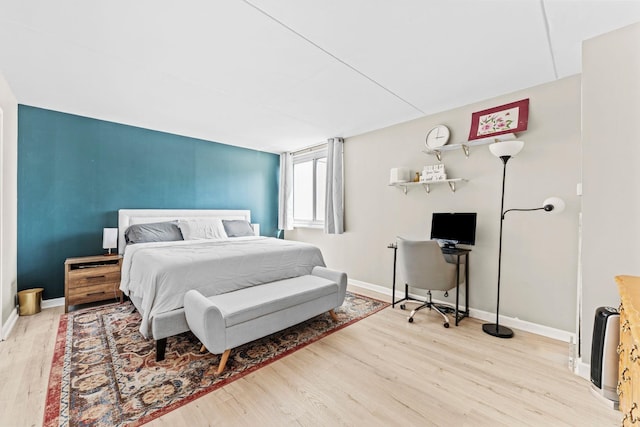 1055 River Rd Unit 301, Edgewater, NJ 07020 - bedroom with wood finished floors, baseboards, and a desk