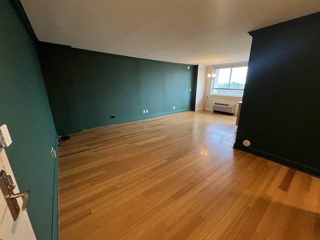100 Manhattan Ave Unit 1104, Union City, NJ 07087 - empty room with light wood-style flooring and a wall mounted air conditioner