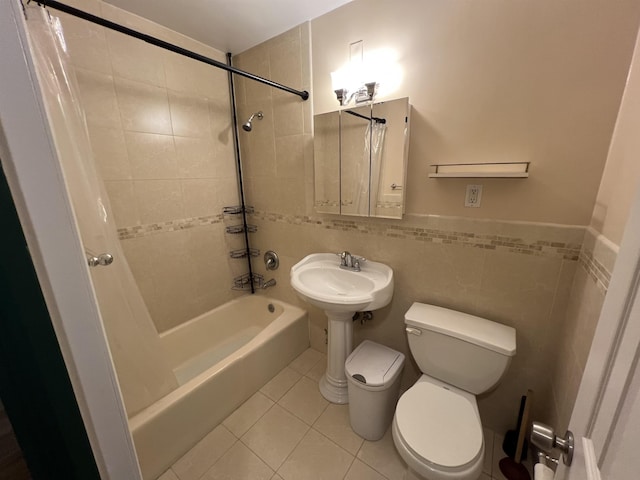 100 Manhattan Ave Unit 1104, Union City, NJ 07087 - bathroom featuring shower / bath combo with shower curtain, tile patterned flooring, and tile walls