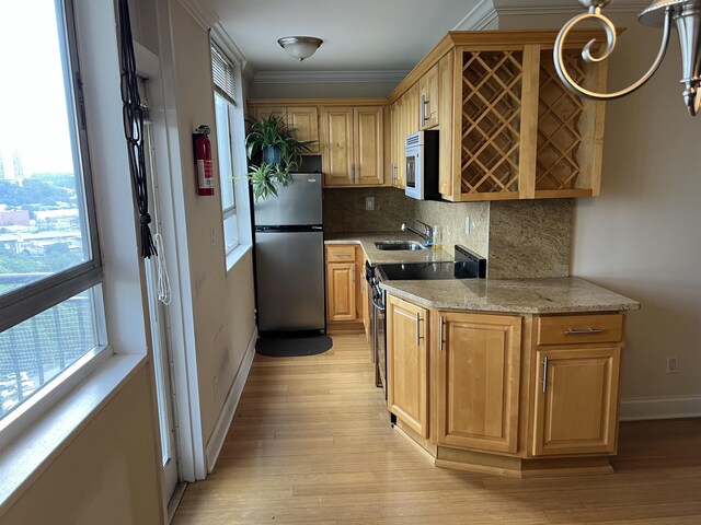 100 Manhattan Ave Unit 1104, Union City, NJ 07087 - kitchen featuring freestanding refrigerator, electric stove, decorative backsplash, crown molding, and light wood-type flooring
