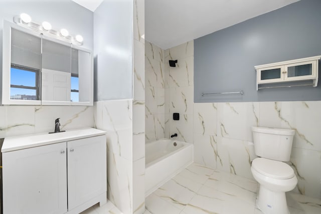 full bathroom featuring vanity, toilet, tile walls, and tiled shower / bath