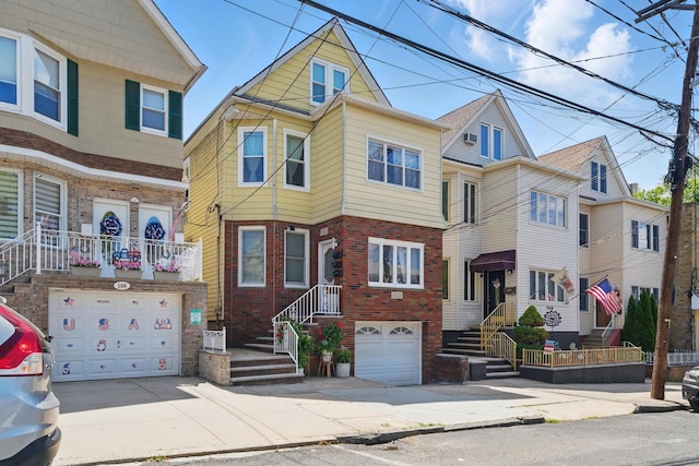 152 W 30th St, Bayonne, NJ 07002 - townhome / multi-family property with a garage, brick siding, and concrete driveway