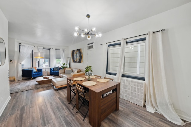 152 W 30th St, Bayonne, NJ 07002 - dining area with a chandelier and wood finished floors