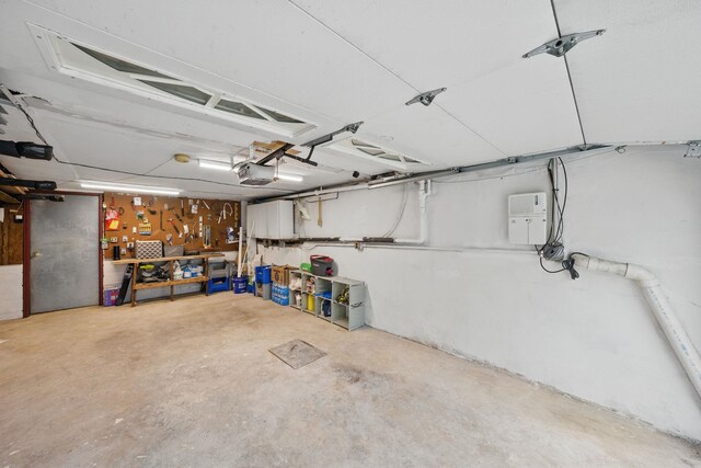 152 W 30th St, Bayonne, NJ 07002 - garage featuring a workshop area and a garage door opener
