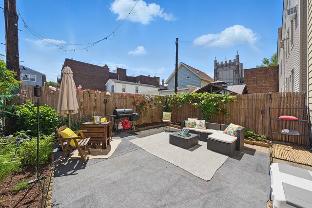 152 W 30th St, Bayonne, NJ 07002 - fenced backyard featuring a patio area, grilling area, and an outdoor living space