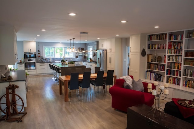 dining area with recessed lighting, visible vents, and light wood-style floors