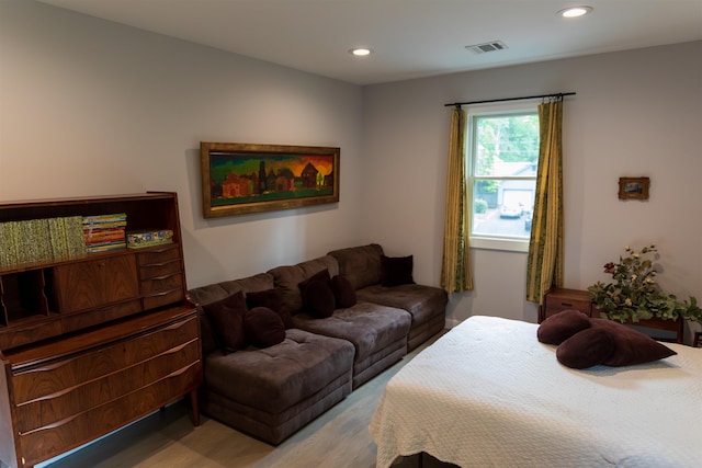 bedroom featuring recessed lighting, visible vents, and light wood finished floors