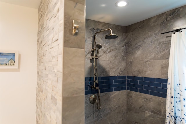 full bath with a tile shower