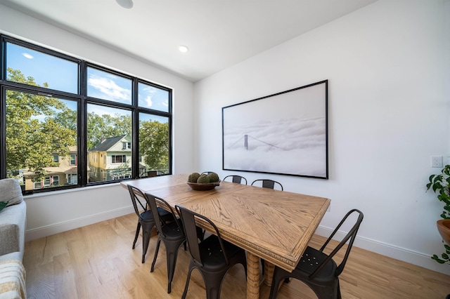 dining area featuring light wood-type flooring