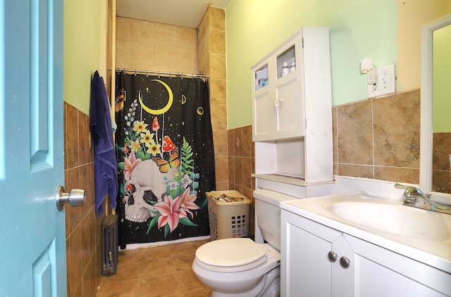 bathroom with toilet, a shower with shower curtain, tile walls, vanity, and radiator heating unit