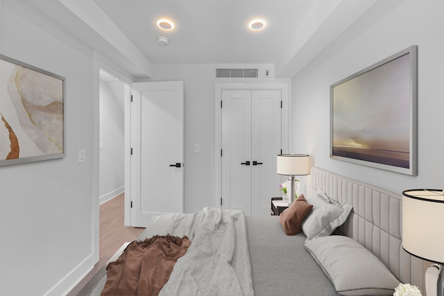 bedroom featuring a closet and light hardwood / wood-style floors