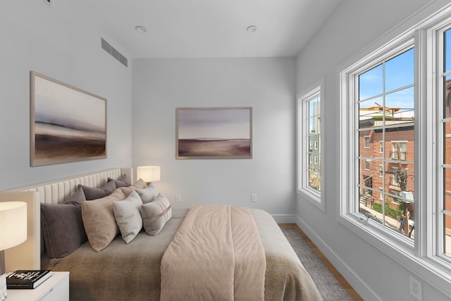 bedroom featuring multiple windows