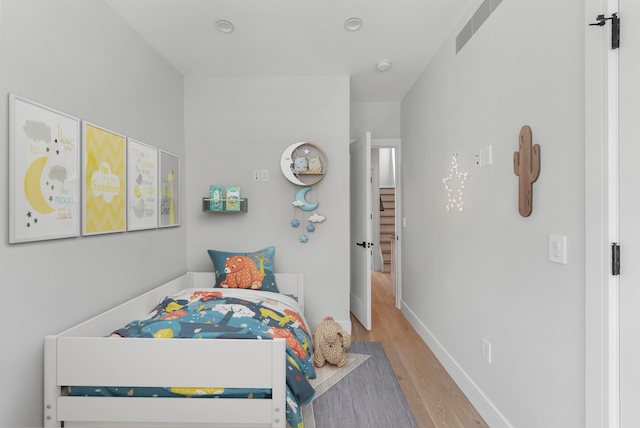 bedroom with light hardwood / wood-style floors