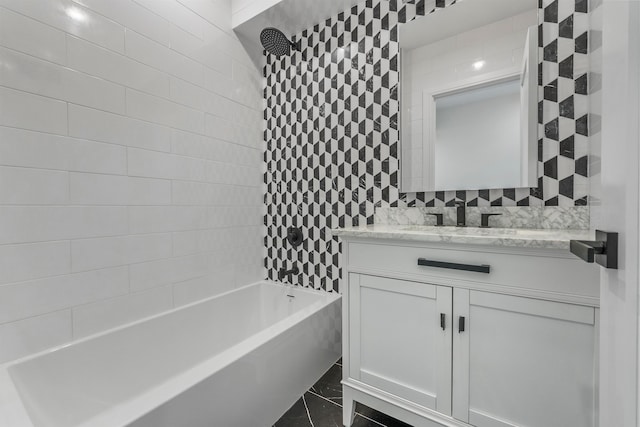 bathroom with vanity and tiled shower / bath