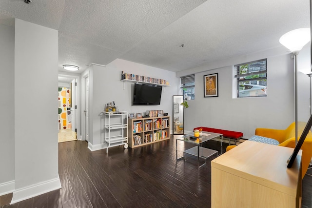 11 Cuneo Pl Unit D, Jersey City, NJ 07307 - living area with a textured ceiling, wood finished floors, and baseboards