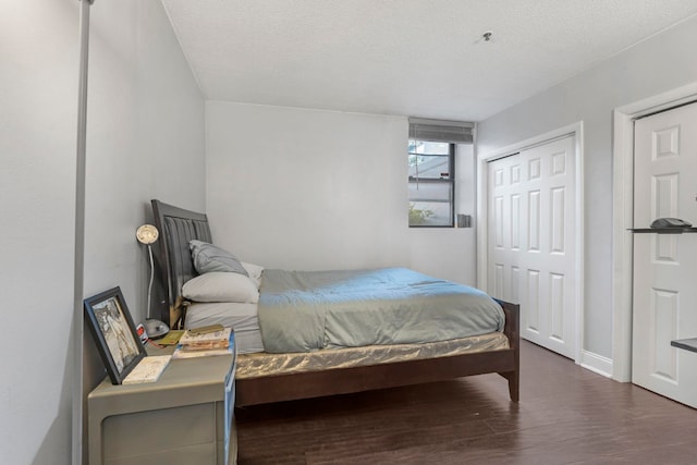 11 Cuneo Pl Unit D, Jersey City, NJ 07307 - bedroom with wood finished floors, a textured ceiling, and baseboards